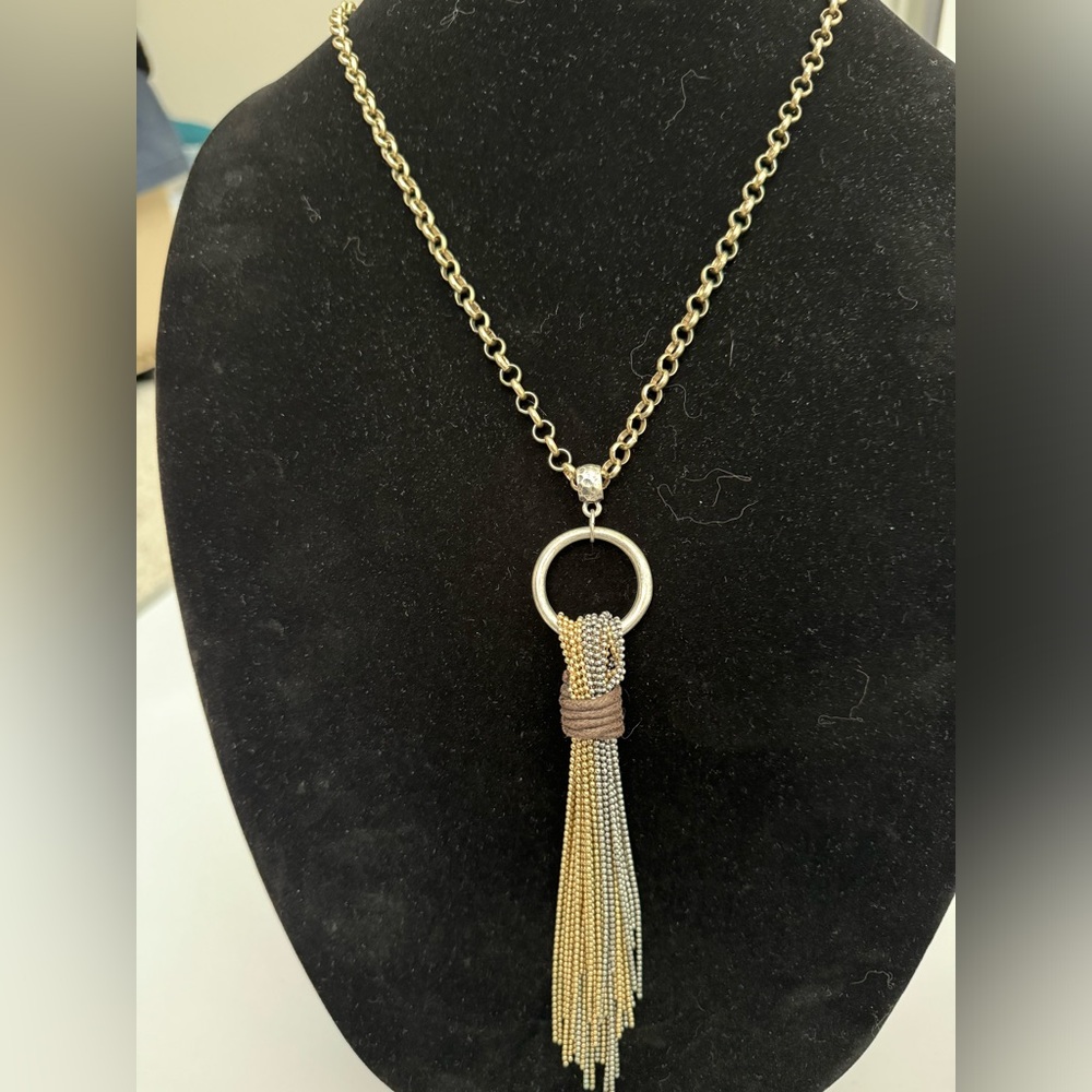 Long tassel gold tone necklace